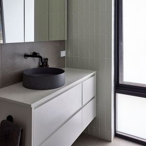 Bathroom with grey vanity and black finishes