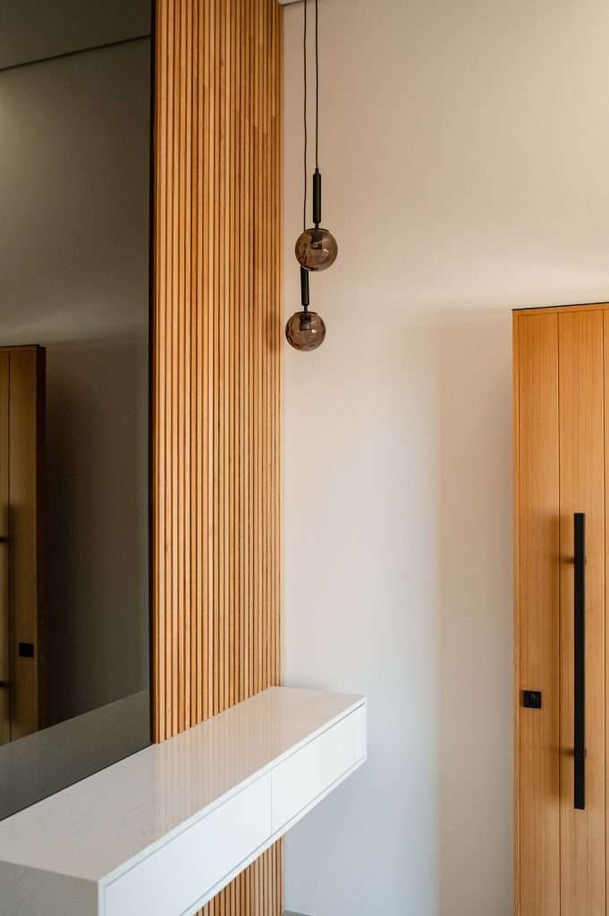 wooden-feature-wall Feature wall with a flutted wooden wall