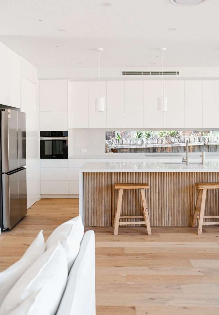 Modern kitchen with wooden flutted island benchtop